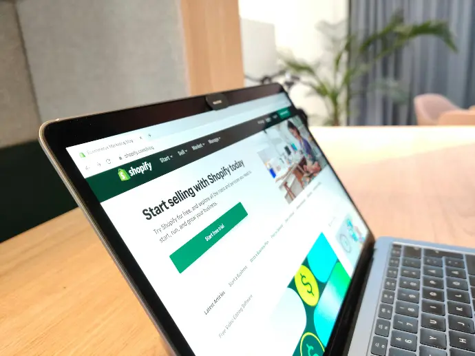 Shopify homepage showcasing the platform's invitation to start selling online, viewed on a modern tablet.